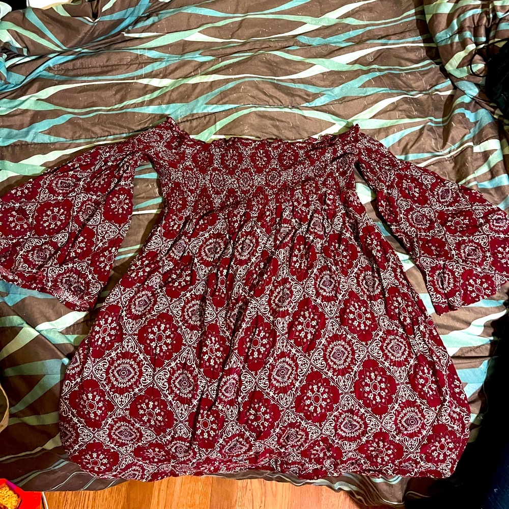 Hippie vibe mini dress with off the shoulder sleeves and tribal pattern!